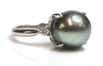 Lot 318 - A cultured Tahitian pearl and diamond ring