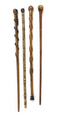 Lot 151 - A folk art carved walking stick
