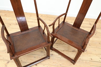 Lot 93 - A pair of Chinese yokeback armchairs