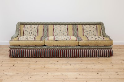 Lot 81 - A three-seater sofa