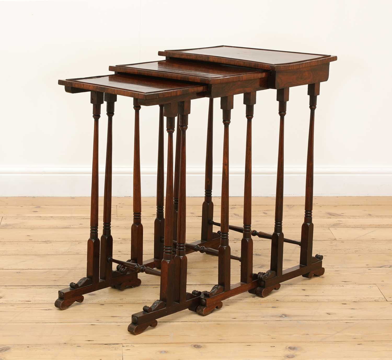 Lot 447 - A William IV rosewood nest of three tables