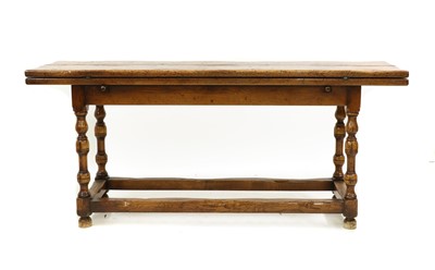 Lot 465 - A 17th century-style folding oak dining table