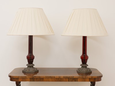 Lot 95 - A pair of large red glass table lamps