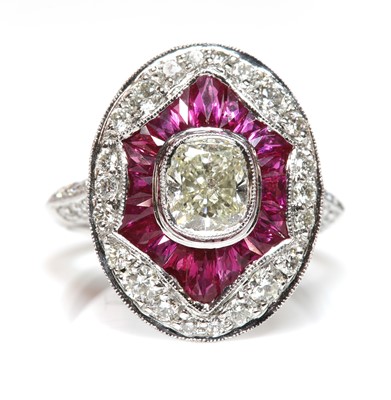 Lot 481 - An Art Deco-style platinum diamond and ruby target cluster ring