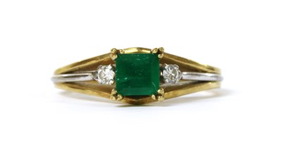 Lot 1191 - A two colour gold emerald and diamond ring