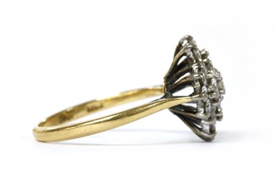 Lot 1107 - A gold diamond quatrefoil cluster ring