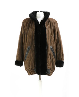 Lot 584 - A Yves Saint Lauren padded, faux fur lined, long jacket