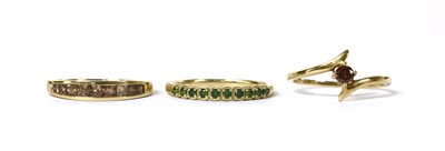 Lot 1391 - A 9ct gold treated green diamond half eternity ring
