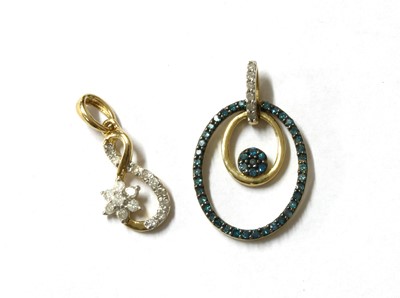 Lot 1383 - A 9ct gold diamond and treated blue diamond pendant