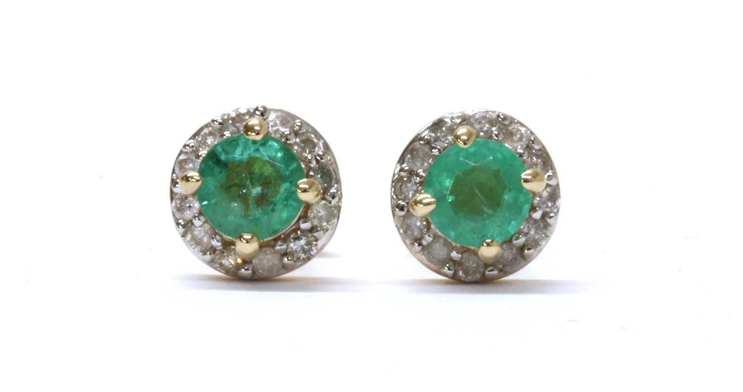 Lot 1188 - A pair of gold emerald and diamond cluster stud earrings