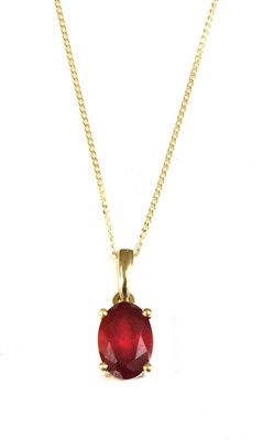 Lot 1142 - A gold single stone fracture filled ruby pendant
