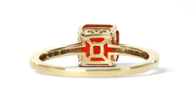Lot 1175 - A gold fire opal and diamond ring