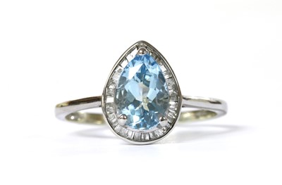 Lot 1238 - A white gold aquamarine and diamond cluster ring
