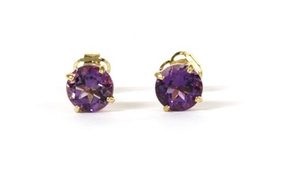 Lot 1251 - A pair of gold single stone amethyst stud earrings