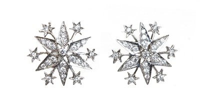 Lot 309 - A pair of 18ct white gold diamond set star burst drop earrings