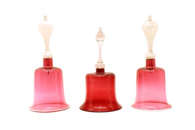 Lot 183 - A near pair of large cranberry glass bells