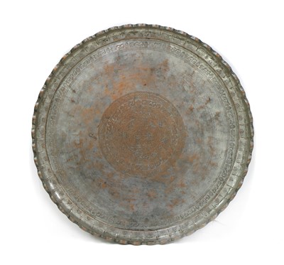 Lot 201 - A large Persian metal tray of circular form
