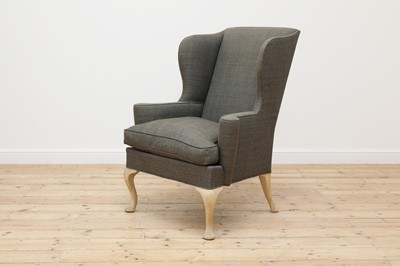Lot 253 - A wing back armchair
