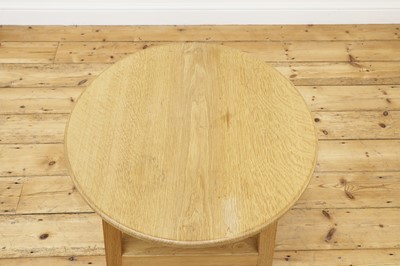 Lot 255 - An oak 'cricket' table