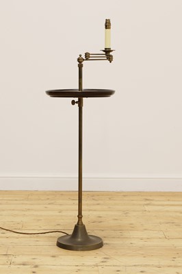 Lot 340 - A brass and oak reading lamp with table tier