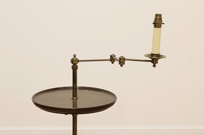 Lot 340 - A brass and oak reading lamp with table tier