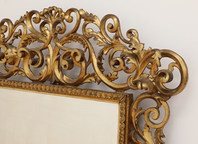 Lot 609 - A carved giltwood Florentine mirror