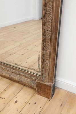 Lot 55 - A monumental carved pine-framed wall mirror