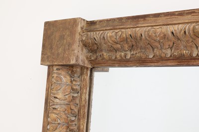 Lot 55 - A monumental carved pine-framed wall mirror