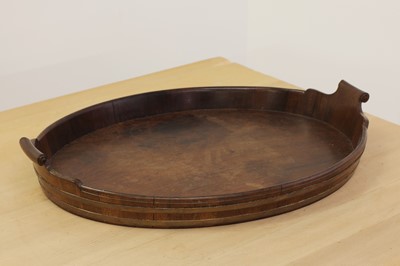 Lot 214 - A George III mahogany oval tray