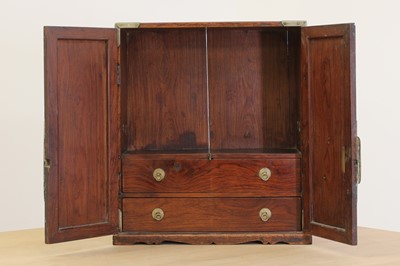 Lot 114 - A small Chinese rosewood and paktong-mounted cabinet