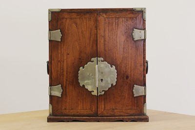 Lot 114 - A small Chinese rosewood and paktong-mounted cabinet