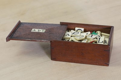 Lot 622 - A bone spelling set