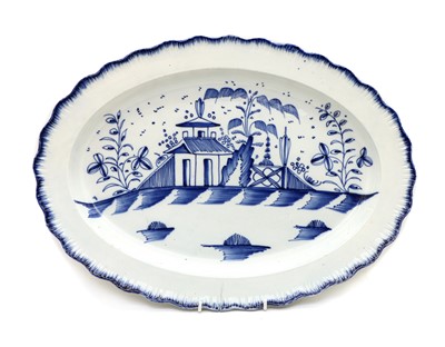 Lot 254 - An early 19th century blue and white oval pearlware plate