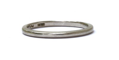 Lot 1135 - A platinum 'D' section wedding ring