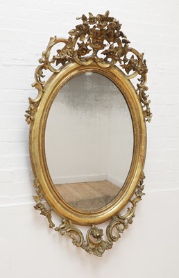 Lot 520 - A rococo-style giltwood mirror