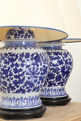 Lot 666 - A pair of Chinese blue and white vase table lamps and shades