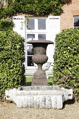 Lot 818 - A cast iron urn