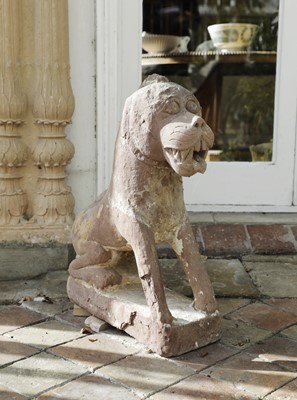 Lot 819 - A carved red sandstone lion