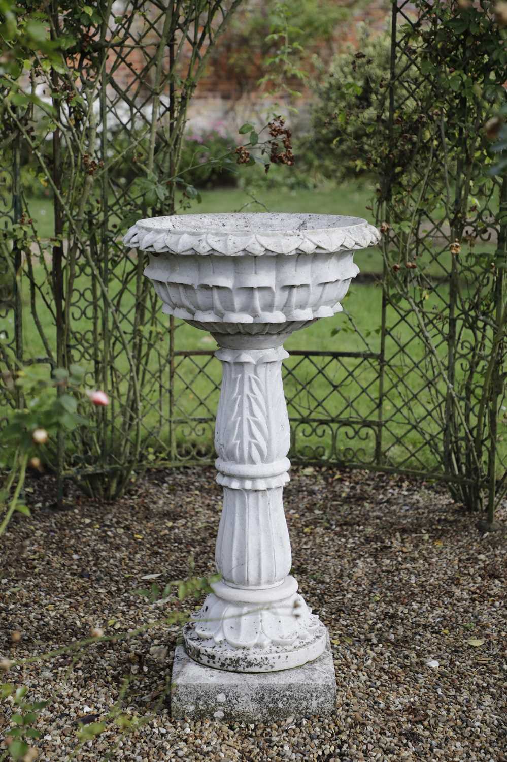 Lot 832 - A carved marble pedestal font