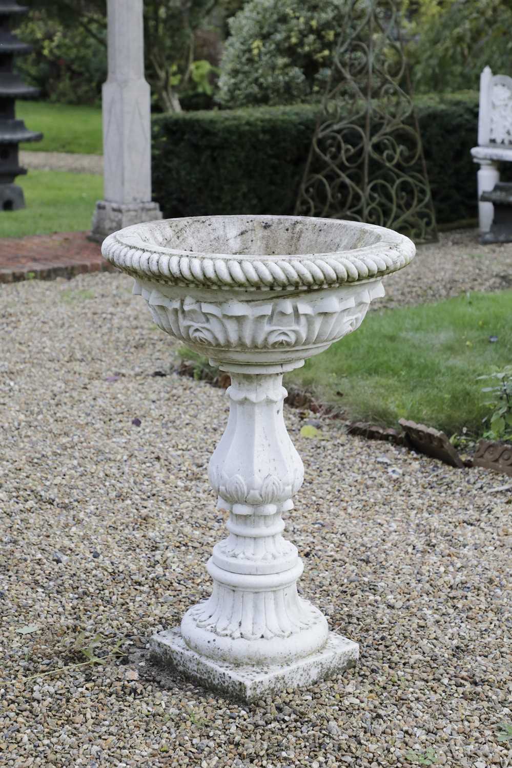 Lot 834 - A carved marble pedestal font