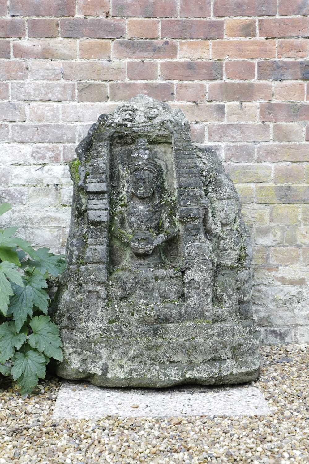 Lot 835 - A carved lava stone figural group