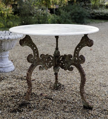 Lot 837 - A marble-topped iron garden table