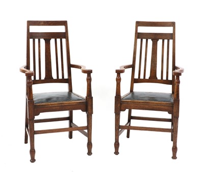 Lot 194 - A pair of Arts and Crafts oak armchairs