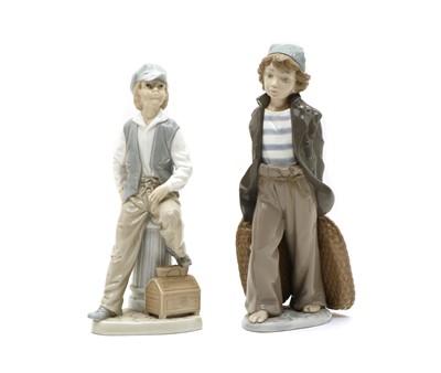 Lot 120 - A Lladro figure of a boy with two baskets