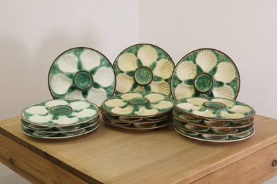 Lot 766 - A set of sixteen Longchamp majolica oyster plates