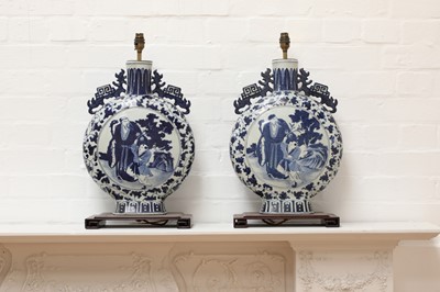 Lot 139 - A pair of Chinese blue and white moon flask table lamps