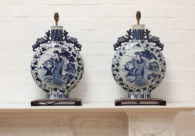 Lot 139 - A pair of Chinese blue and white moon flask table lamps