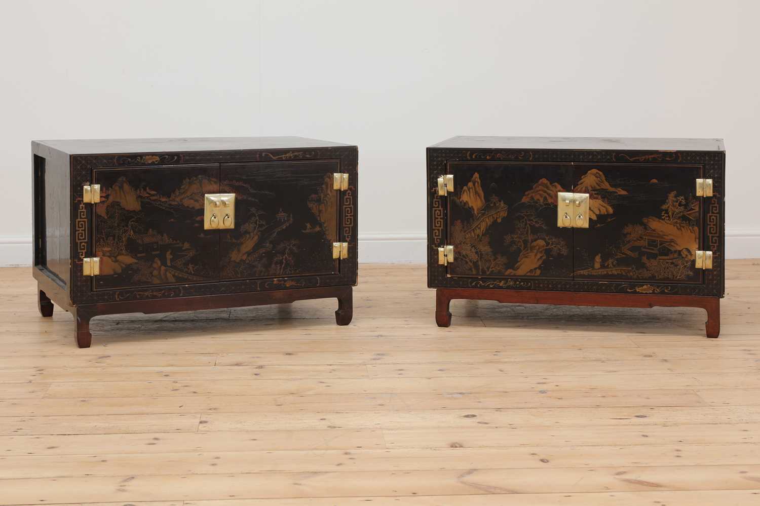 Lot 124 - A pair of lacquered low table cabinets