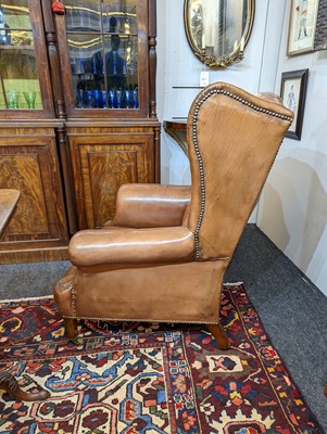 Lot 218 - A pair of wing back armchairs