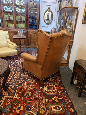 Lot 218 - A pair of wing back armchairs